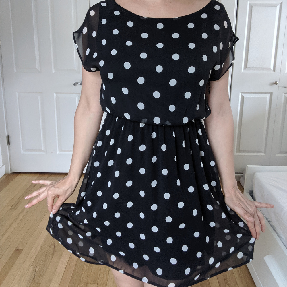 Polka dots, black mini dress